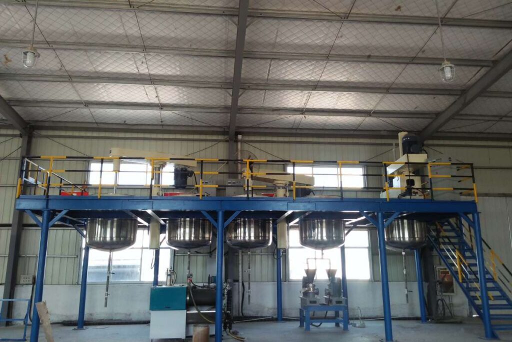 China vs Global Coating Suppliers: Cost, Quality and Performance Comparison for Industrial Projects (2026) 2 Resin dissolving kettles operating inside the Huili Coating workshop.